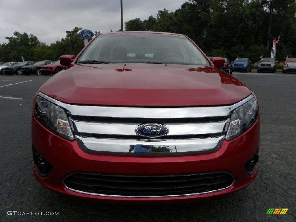 2010 Fusion SE V6 - Red Candy Metallic / Medium Light Stone photo #7