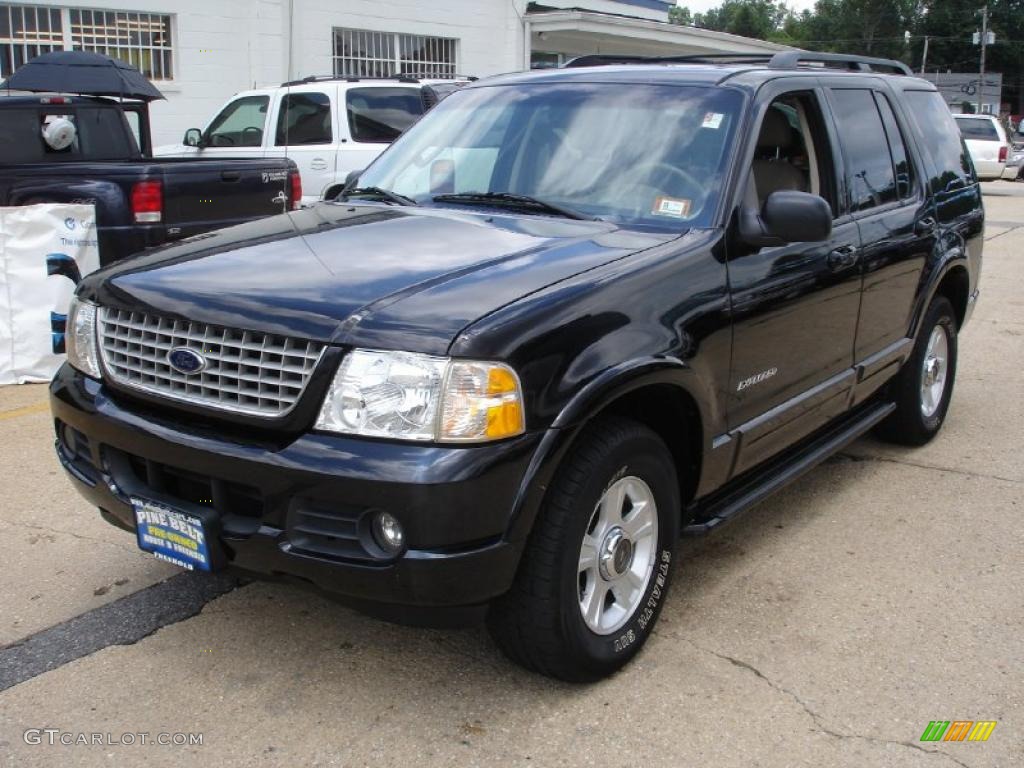 2002 Explorer Limited 4x4 - Black Clearcoat / Medium Parchment photo #1