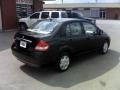 2009 Super Black Nissan Versa 1.8 S Sedan  photo #5