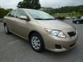 2010 Desert Sand Metallic Toyota Corolla LE  photo #1