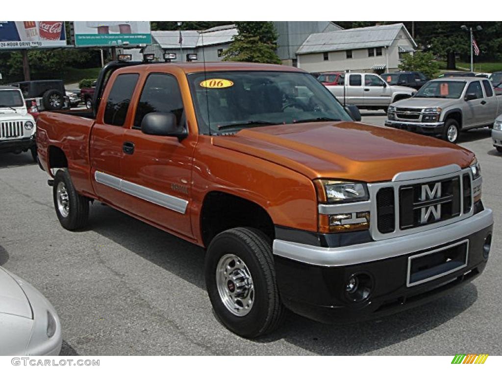 2006 Silverado 2500HD Work Truck Extended Cab 4x4 - Custom Orange Metallic / Dark Charcoal photo #26