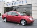 2005 Sangria Red Metallic Ford Focus ZX4 SE Sedan  photo #1