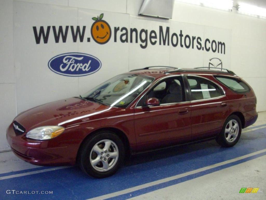 2003 Taurus SE Wagon - Matador Red Metallic / Medium Graphite photo #1