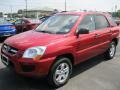 2010 Volcanic Red Kia Sportage LX V6 4x4  photo #1