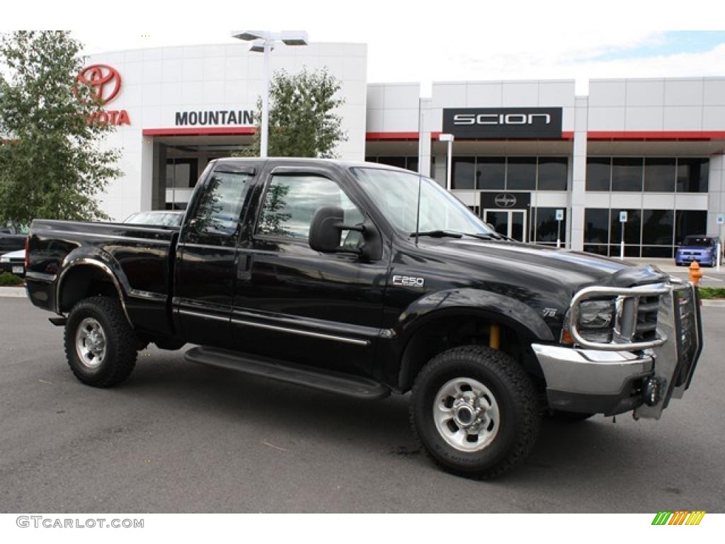 1999 F250 Super Duty Lariat Extended Cab 4x4 - Black / Medium Prairie Tan photo #1