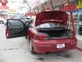 1997 Medium Red Metallic Pontiac Grand Am GT Coupe  photo #7