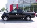 2010 Super Black Nissan Frontier XE King Cab  photo #2