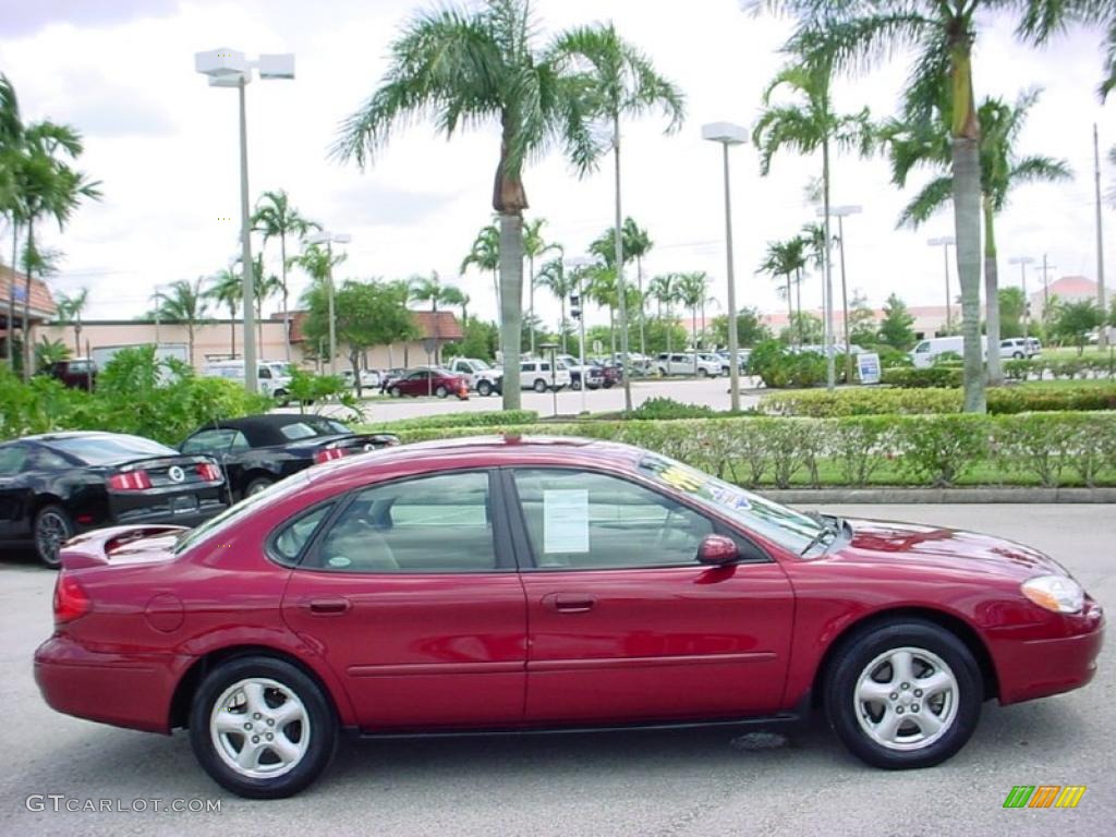 2003 Taurus SE - Matador Red Metallic / Medium Parchment photo #5