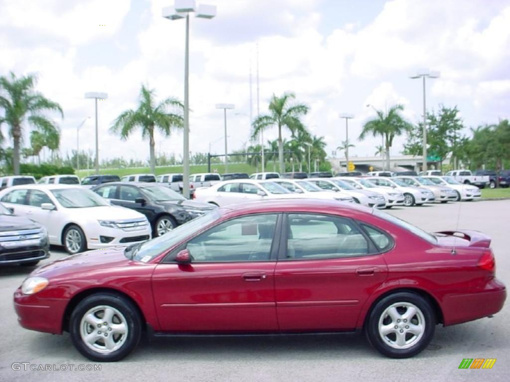 2003 Taurus SE - Matador Red Metallic / Medium Parchment photo #9