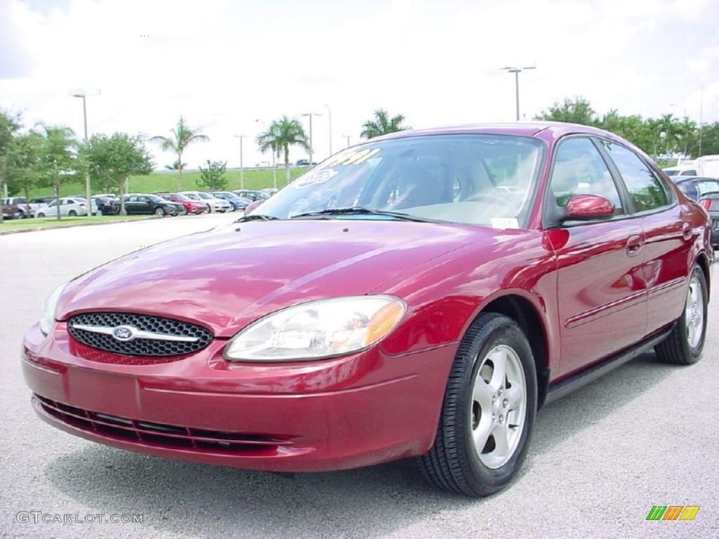 2003 Taurus SE - Matador Red Metallic / Medium Parchment photo #13