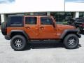2010 Mango Tango Pearl Jeep Wrangler Unlimited Sport 4x4  photo #1