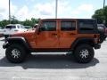 2010 Mango Tango Pearl Jeep Wrangler Unlimited Sport 4x4  photo #5