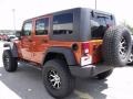 2010 Mango Tango Pearl Jeep Wrangler Unlimited Sport 4x4  photo #6
