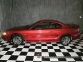 1998 Laser Red Ford Mustang V6 Coupe  photo #1