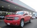 2009 Victory Red Chevrolet Avalanche LT  photo #1