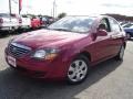 2009 Spicy Red Metallic Kia Spectra EX Sedan  photo #1