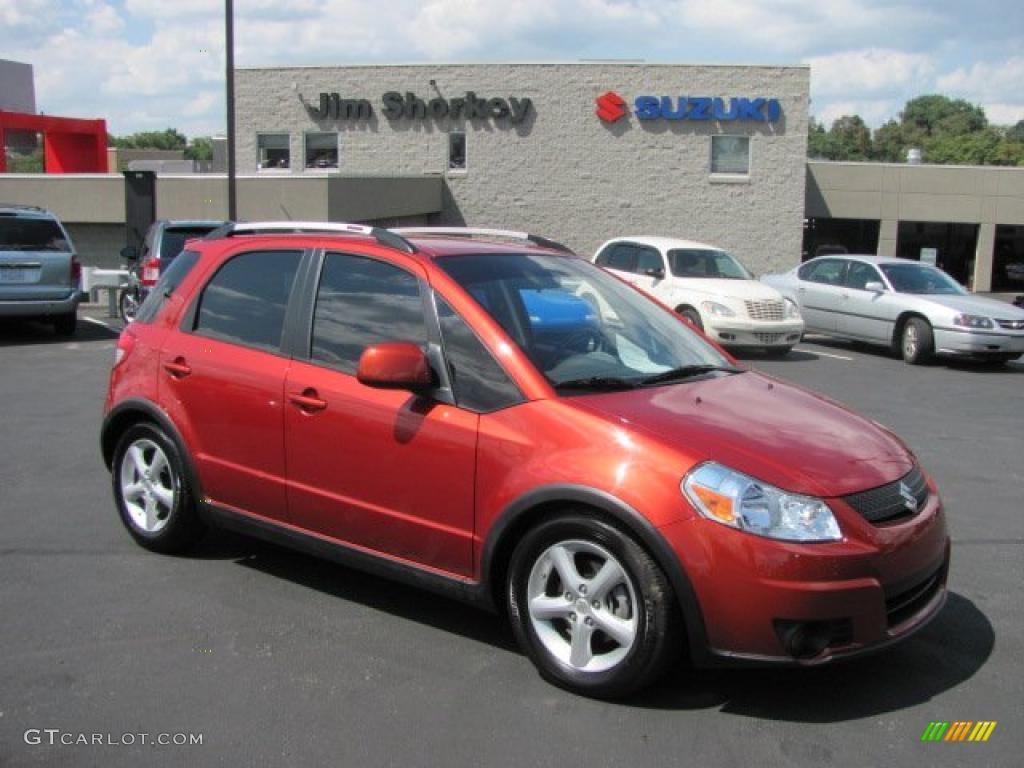 2009 SX4 Crossover Touring AWD - Sunlight Copper Metallic / Black photo #1