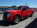 2009 Bright Red Ford F150 STX SuperCab 4x4  photo #5