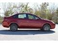 2010 Sangria Red Metallic Ford Focus SES Sedan  photo #9