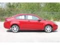 2010 Sangria Red Metallic Ford Focus SE Coupe  photo #9