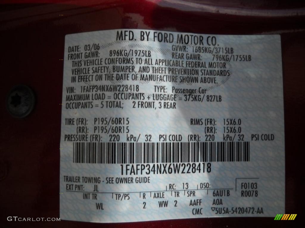2006 Focus ZX4 SE Sedan - Dark Toreador Red Metallic / Dark Flint/Light Flint photo #9