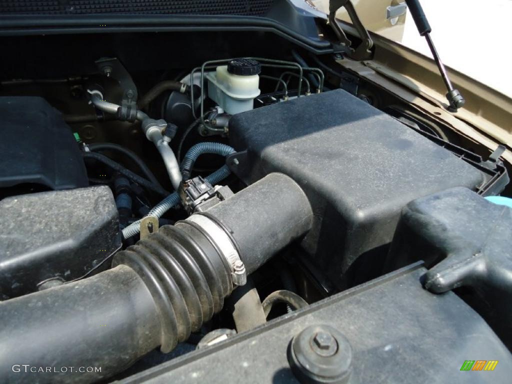 2004 Titan XE Crew Cab - Copper / Sand/Steel photo #27