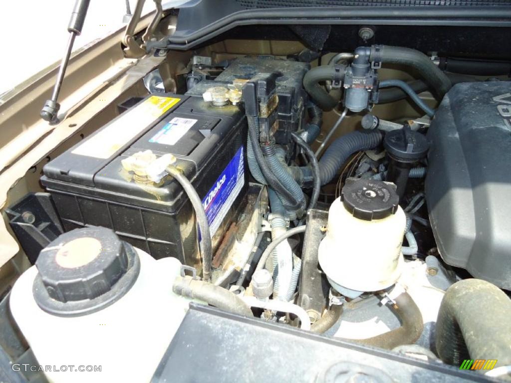2004 Titan XE Crew Cab - Copper / Sand/Steel photo #28