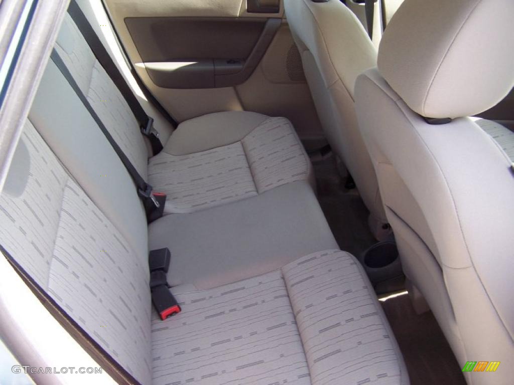 2009 Focus SE Sedan - Light Ice Blue Metallic / Medium Stone photo #14