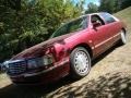 1997 Dark Cherry Red Metallic Cadillac DeVille Sedan #36192888