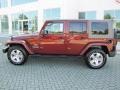 2009 Red Rock Crystal Pearl Jeep Wrangler Unlimited Sahara  photo #2