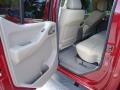 2008 Red Brawn Nissan Frontier LE Crew Cab  photo #7