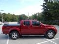 2008 Red Brawn Nissan Frontier LE Crew Cab  photo #13