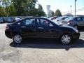 2011 Ebony Black Ford Focus SEL Sedan  photo #6