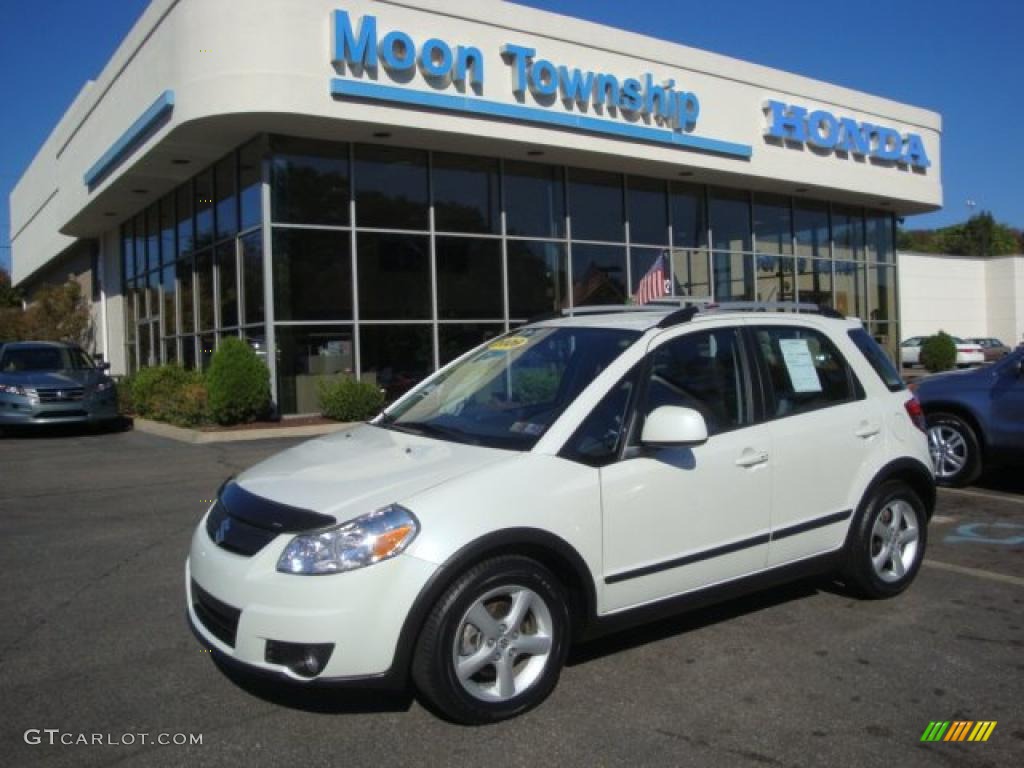 2009 SX4 Crossover Touring AWD - White Water Pearl / Black photo #1