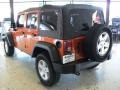 2011 Mango Tango Pearl Jeep Wrangler Unlimited Sport 4x4  photo #2