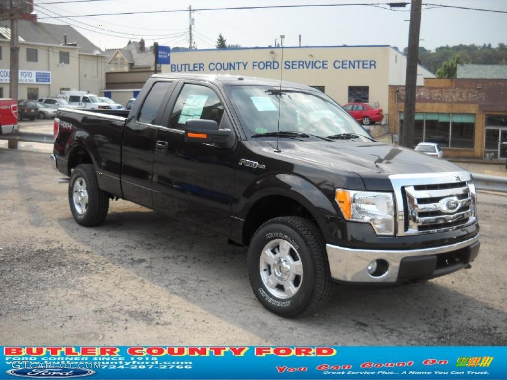 2010 F150 XLT SuperCab 4x4 - Tuxedo Black / Medium Stone photo #1