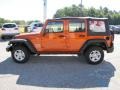 2011 Mango Tango Pearl Jeep Wrangler Unlimited Sport 4x4  photo #4