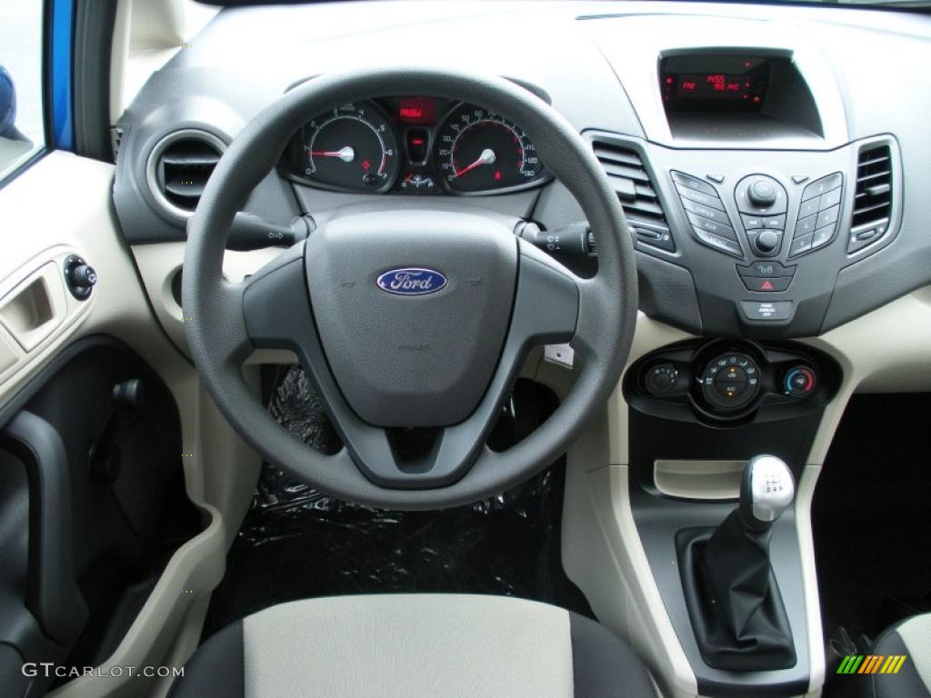 2011 Ford Fiesta S Sedan Light Stone/Charcoal Black Cloth Steering Wheel Photo #37308677