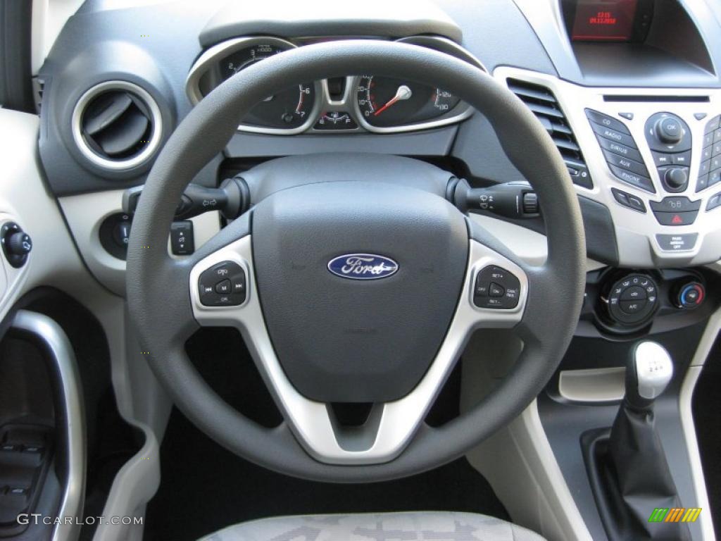 2011 Ford Fiesta SE Hatchback Light Stone/Charcoal Black Cloth Steering Wheel Photo #37889652