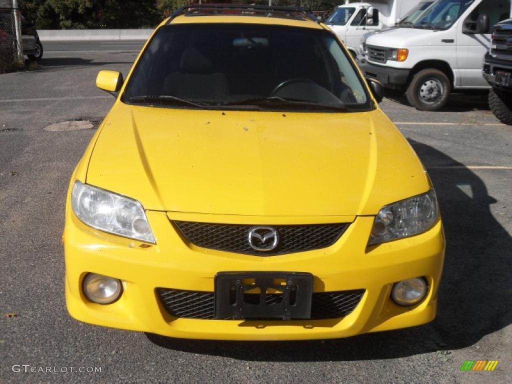Vivid Yellow Mazda Protege
