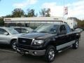 2006 Black Ford F150 XLT SuperCab 4x4  photo #1