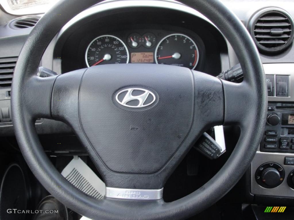 2004 Hyundai Tiburon Standard Tiburon Model Black Steering Wheel Photo #38545511