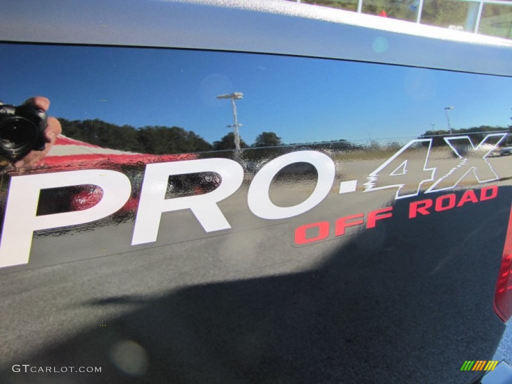 2011 Frontier Pro-4X Crew Cab 4x4 - Super Black / Pro 4X Graphite/Red photo #11