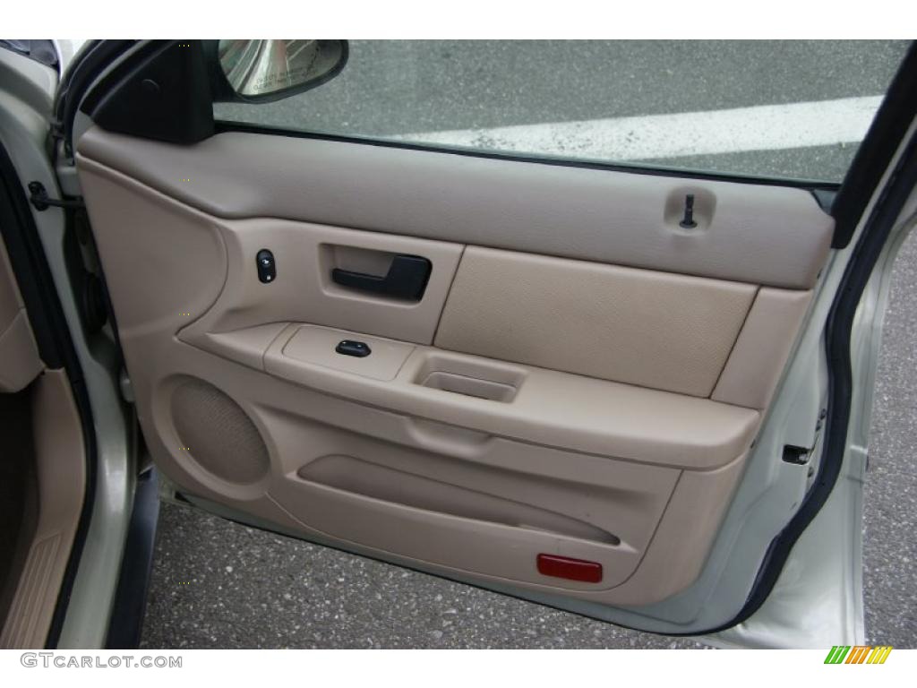 2006 Ford Taurus SE Medium/Dark Pebble Beige Door Panel Photo #38621881