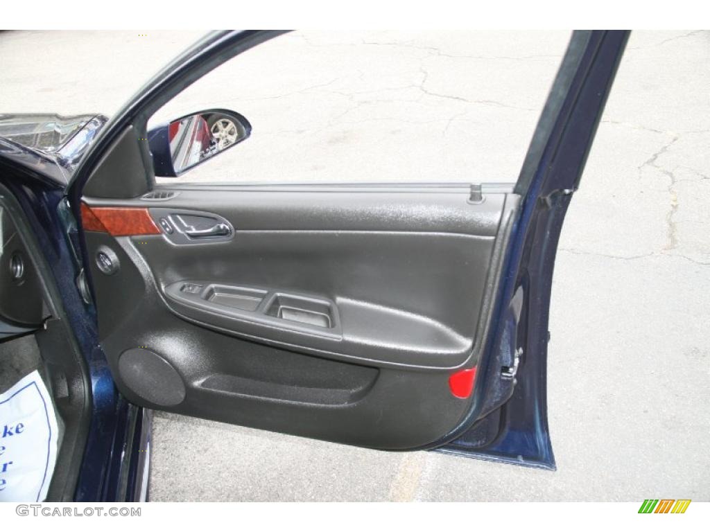 2010 Chevrolet Impala LT Ebony Door Panel Photo #38672455