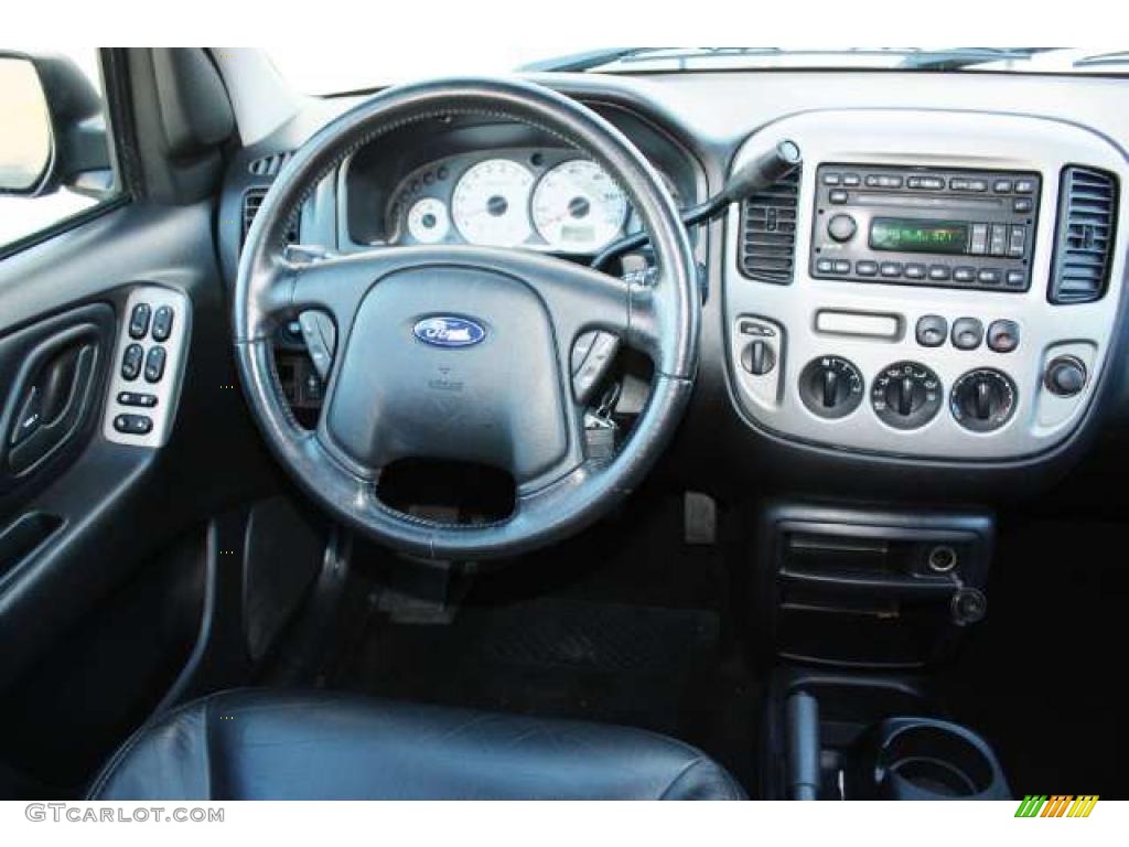 2004 Ford Escape Limited 4WD Ebony Black Dashboard Photo #38694182