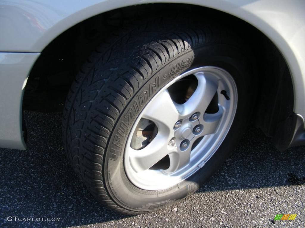 2005 Taurus SE - Gold Ash Metallic / Medium/Dark Pebble photo #26