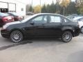 2011 Ebony Black Ford Focus SES Sedan  photo #1