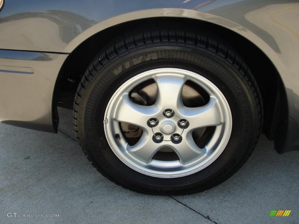 2004 Ford Taurus SE Sedan Wheel Photo #38881329