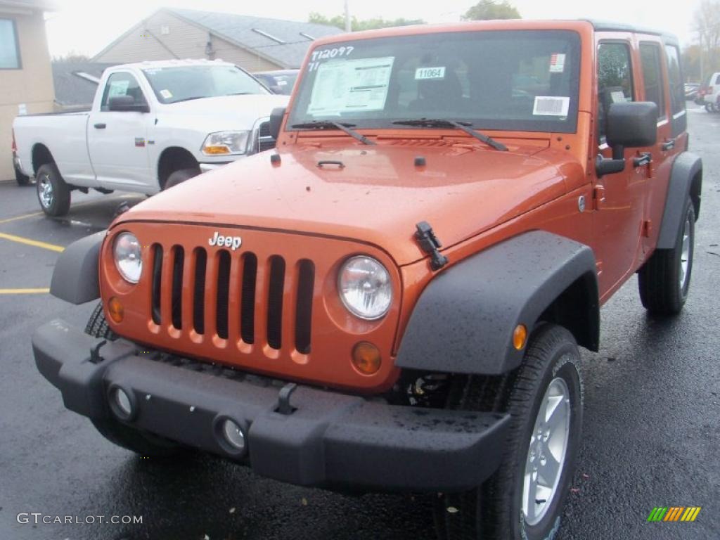 2011 Wrangler Unlimited Sport 4x4 - Mango Tango Pearl / Black photo #1